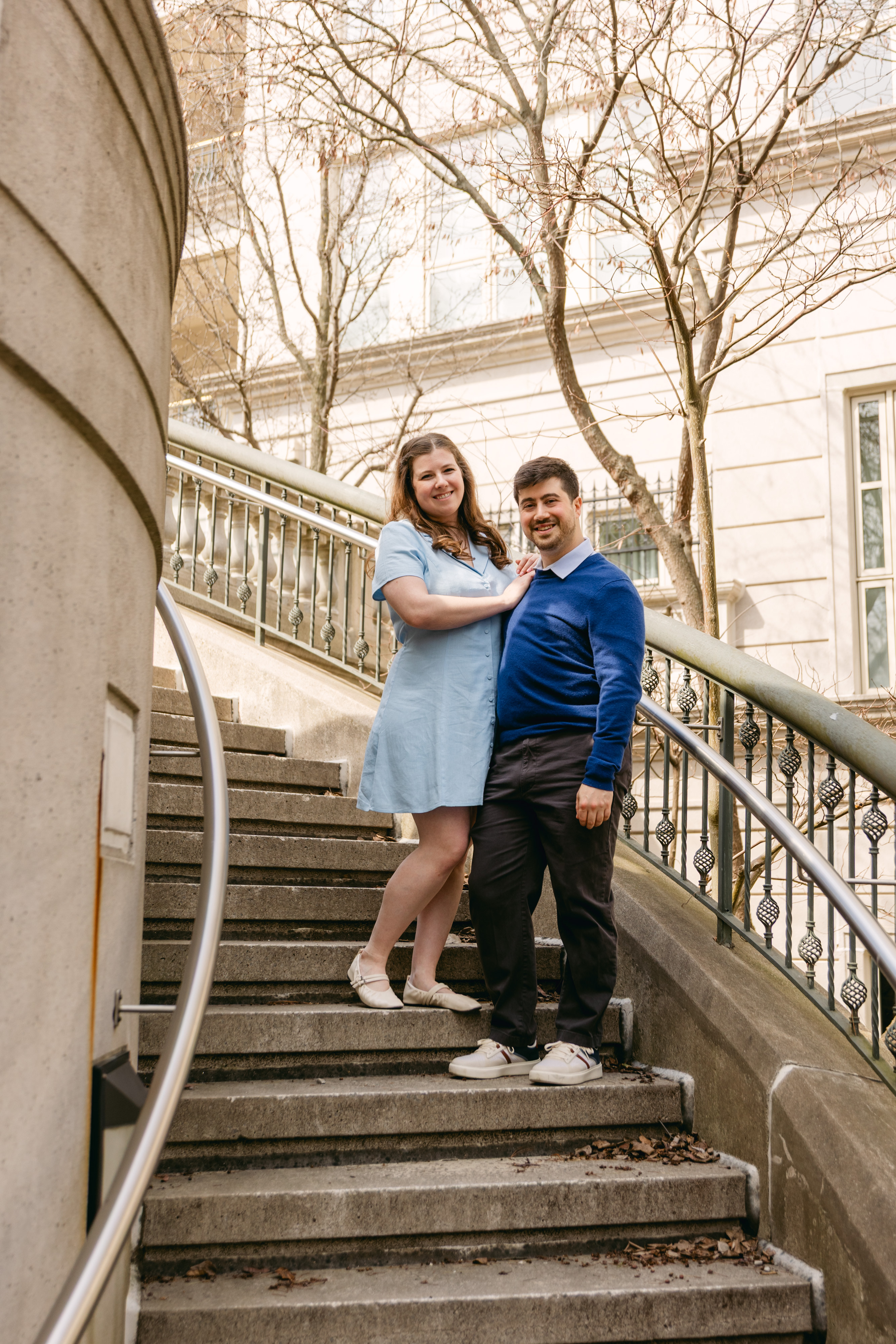 Hailey and Jessie standing together on outdoor stone steps.